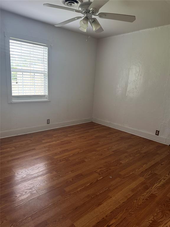 201 S Oak St, Pauls Valley, OK 73075 - unfurnished room with a ceiling fan and dark wood finished floors