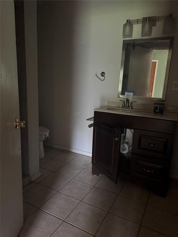 201 S Oak St, Pauls Valley, OK 73075 - half bathroom featuring tile patterned flooring and vanity