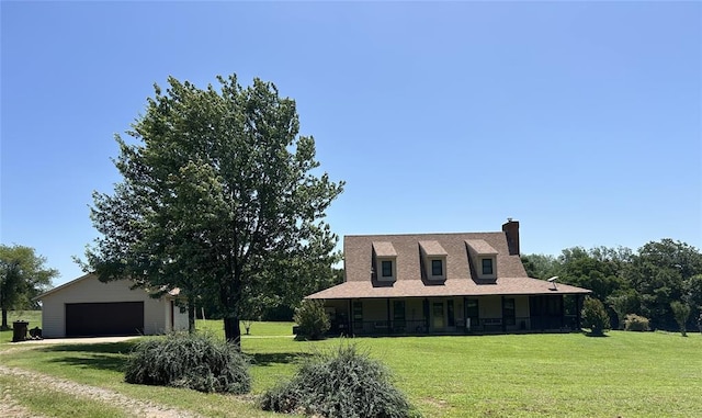 344393 E 930th Rd, Chandler, OK 74834 - farmhouse inspired home with a garage, a front lawn, an outdoor structure, and a chimney