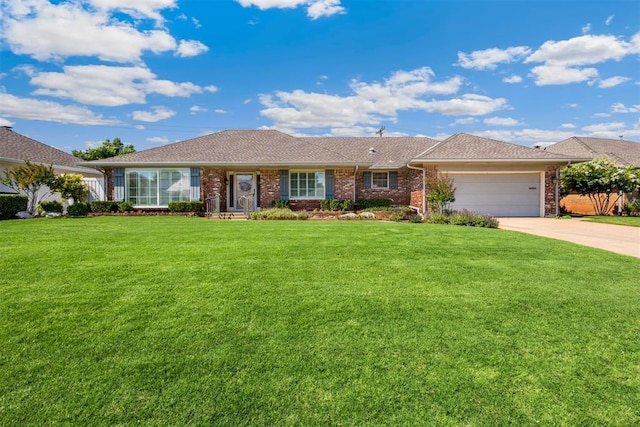 2709 NW 60th St, Oklahoma City, OK 73112 - ranch-style home featuring a garage, concrete driveway, brick siding, and a front yard