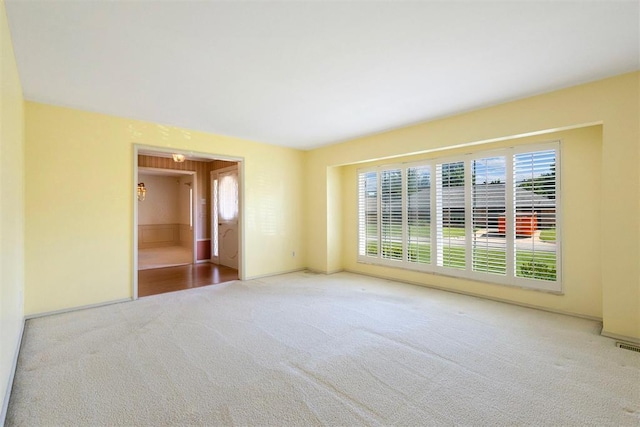 2709 NW 60th St, Oklahoma City, OK 73112 - unfurnished room featuring carpet floors and healthy amount of natural light