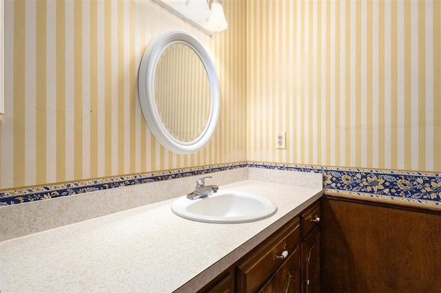 2709 NW 60th St, Oklahoma City, OK 73112 - bathroom featuring vanity and wallpapered walls
