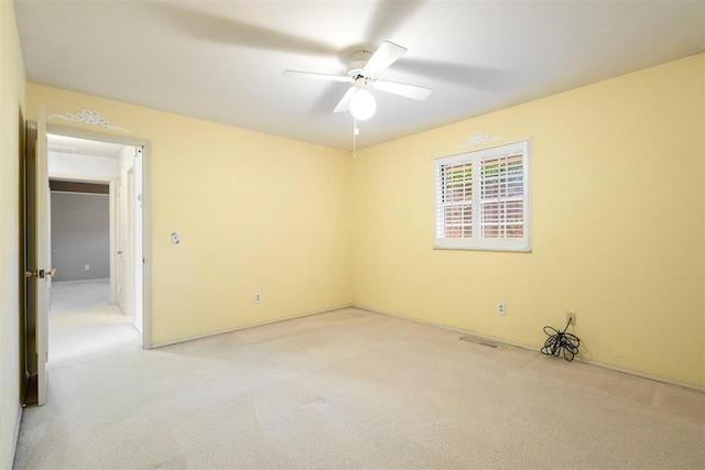 2709 NW 60th St, Oklahoma City, OK 73112 - empty room featuring light carpet and a ceiling fan