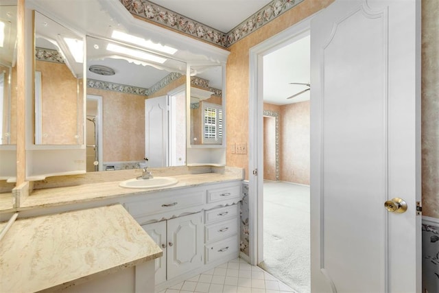 2709 NW 60th St, Oklahoma City, OK 73112 - bathroom with wallpapered walls, vanity, and tile patterned floors