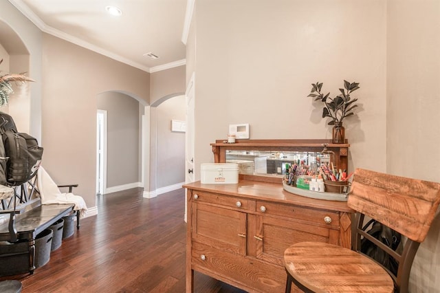 3101 Firewheel Rd, Edmond, OK 73013 - sitting room featuring arched walkways, dark wood finished floors, and ornamental molding