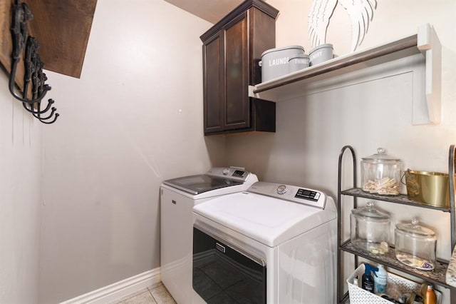 3101 Firewheel Rd, Edmond, OK 73013 - washroom with cabinet space, washing machine and dryer, and light tile patterned floors
