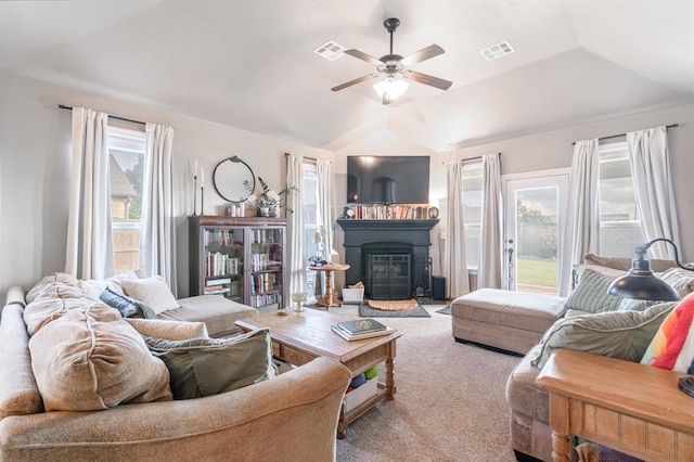 3101 Firewheel Rd, Edmond, OK 73013 - carpeted living room with ceiling fan, vaulted ceiling, and a fireplace with flush hearth