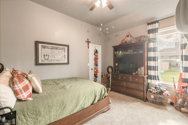 3101 Firewheel Rd, Edmond, OK 73013 - carpeted bedroom with vaulted ceiling, multiple windows, and a ceiling fan
