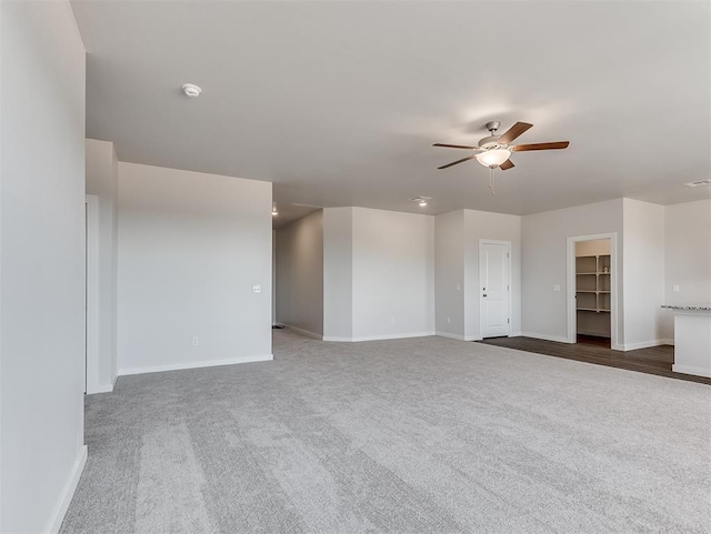 13172 Mannington Rd, Edmond, OK 73025 - unfurnished living room with a ceiling fan and carpet floors