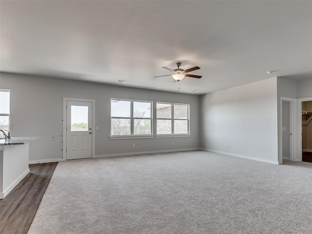 13172 Mannington Rd, Edmond, OK 73025 - unfurnished living room featuring ceiling fan and dark carpet