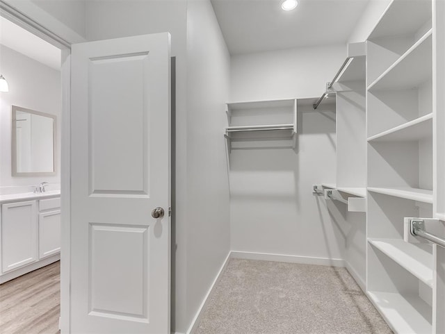 13172 Mannington Rd, Edmond, OK 73025 - spacious closet featuring a sink and light carpet