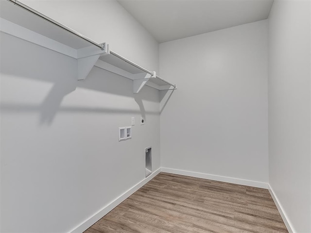 13172 Mannington Rd, Edmond, OK 73025 - washroom featuring electric dryer hookup, wood finished floors, washer hookup, and gas dryer hookup