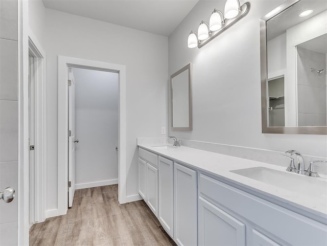 13172 Mannington Rd, Edmond, OK 73025 - full bathroom with wood finished floors and double vanity
