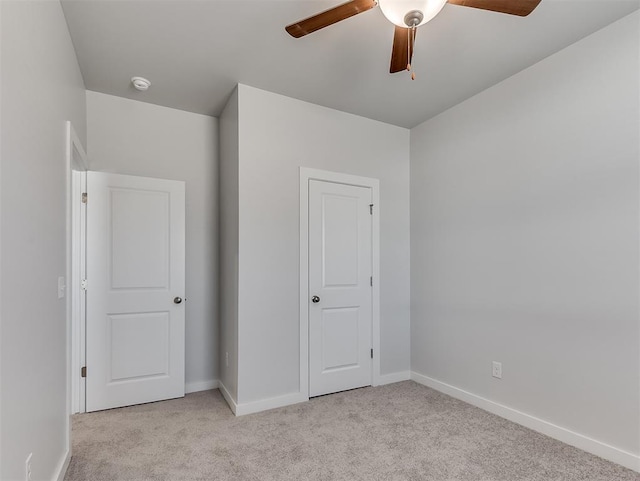 13172 Mannington Rd, Edmond, OK 73025 - unfurnished bedroom featuring light colored carpet and a ceiling fan