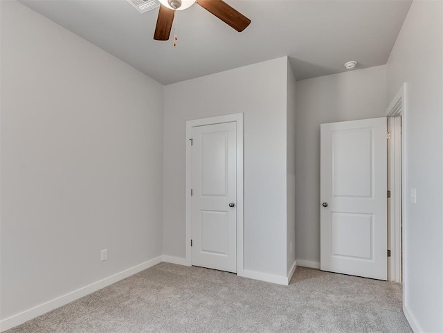 13172 Mannington Rd, Edmond, OK 73025 - unfurnished bedroom with light carpet and a ceiling fan