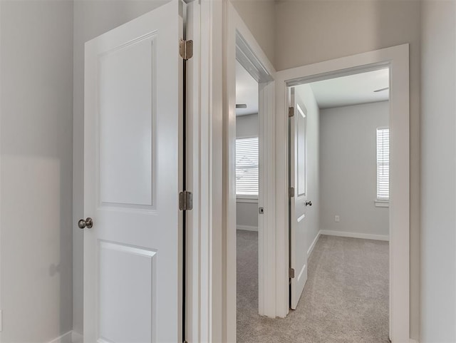 13172 Mannington Rd, Edmond, OK 73025 - hallway with light carpet and baseboards