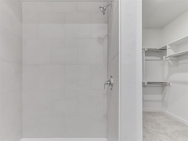 13172 Mannington Rd, Edmond, OK 73025 - full bathroom featuring a spacious closet and a tile shower