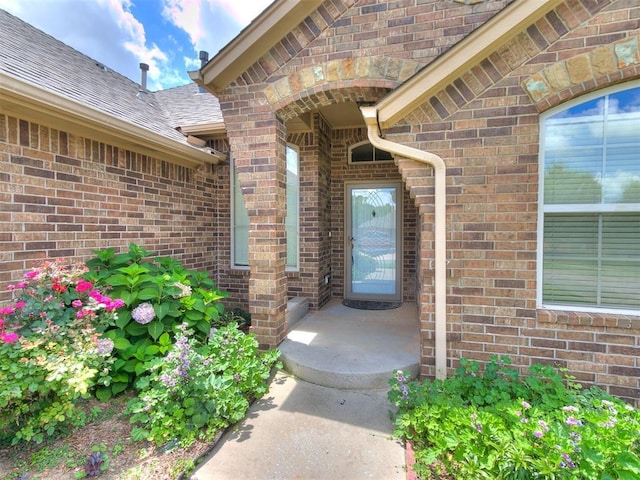 12824 NW 6th St, Yukon, OK 73099 - entrance to property with brick siding and a shingled roof