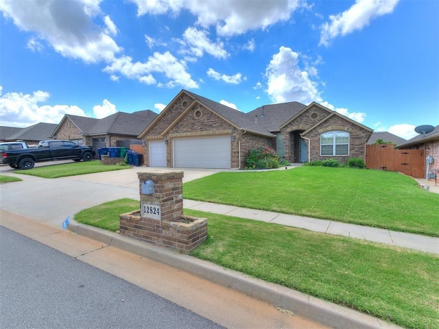 12824 NW 6th St, Yukon, OK 73099 - ranch-style house with driveway, a garage, and brick siding