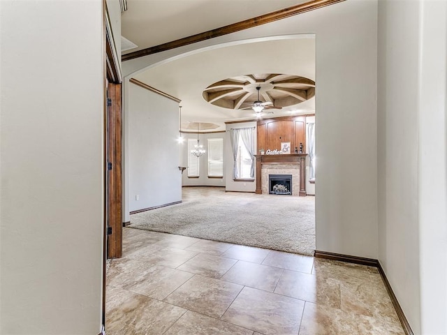 12824 NW 6th St, Yukon, OK 73099 - unfurnished living room with a ceiling fan, a fireplace, carpet floors, arched walkways, and coffered ceiling