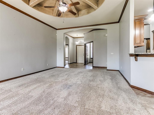 12824 NW 6th St, Yukon, OK 73099 - unfurnished room with arched walkways, ceiling fan, ornamental molding, carpet floors, and beam ceiling