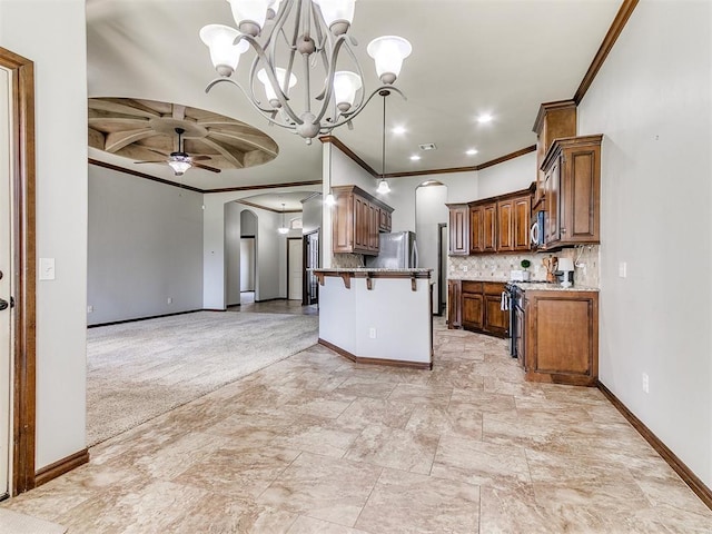 12824 NW 6th St, Yukon, OK 73099 - kitchen with stainless steel appliances, arched walkways, ornamental molding, open floor plan, and ceiling fan