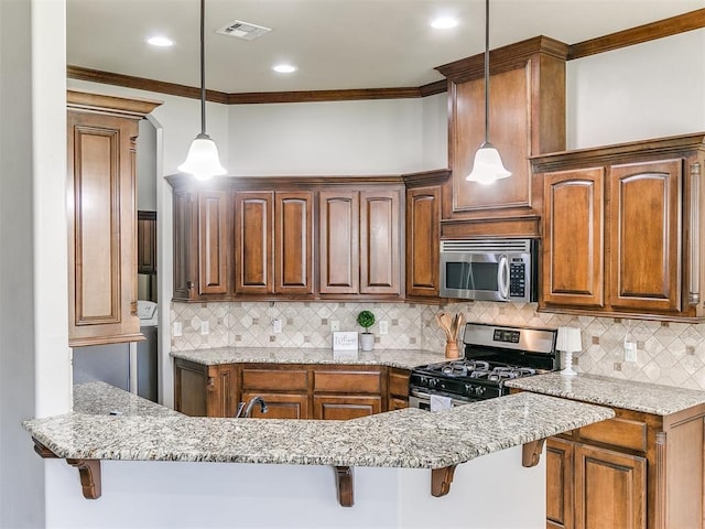 12824 NW 6th St, Yukon, OK 73099 - kitchen featuring appliances with stainless steel finishes, ornamental molding, a kitchen bar, light stone countertops, and tasteful backsplash