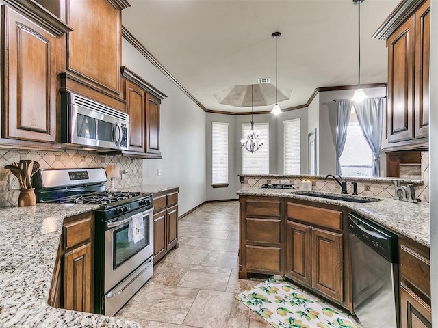 12824 NW 6th St, Yukon, OK 73099 - kitchen featuring stainless steel appliances, ornamental molding, light stone finish floors, backsplash, and light stone counters