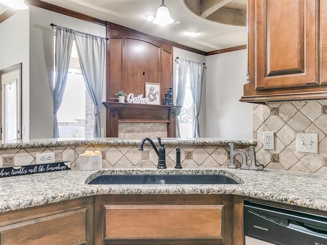 12824 NW 6th St, Yukon, OK 73099 - kitchen featuring dishwashing machine, crown molding, tasteful backsplash, light stone countertops, and brown cabinetry