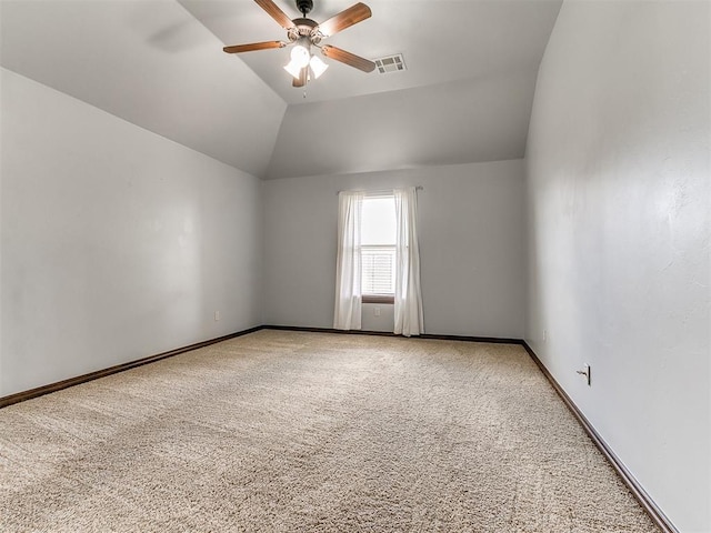 12824 NW 6th St, Yukon, OK 73099 - empty room featuring carpet flooring, ceiling fan, and vaulted ceiling