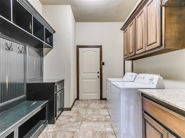 12824 NW 6th St, Yukon, OK 73099 - laundry area featuring separate washer and dryer, cabinet space, and light stone finish floors