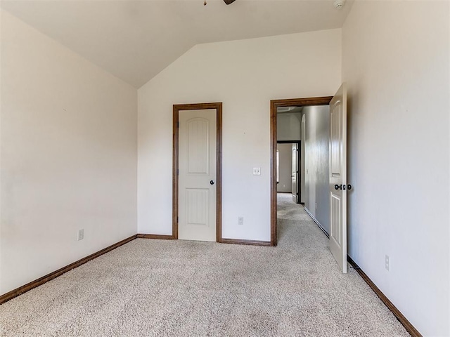 12824 NW 6th St, Yukon, OK 73099 - unfurnished bedroom featuring light carpet and vaulted ceiling