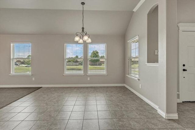 600 Nathan Way, Yukon, OK 73099 - unfurnished dining area with lofted ceiling, a chandelier, arched walkways, and light tile patterned flooring