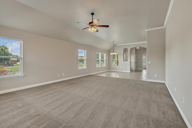 600 Nathan Way, Yukon, OK 73099 - unfurnished living room with carpet flooring, ceiling fan, vaulted ceiling, arched walkways, and a chandelier