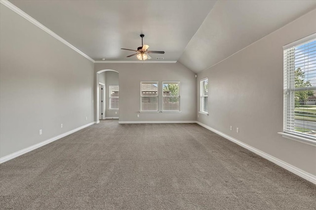 600 Nathan Way, Yukon, OK 73099 - unfurnished living room featuring a ceiling fan, arched walkways, carpet, and vaulted ceiling