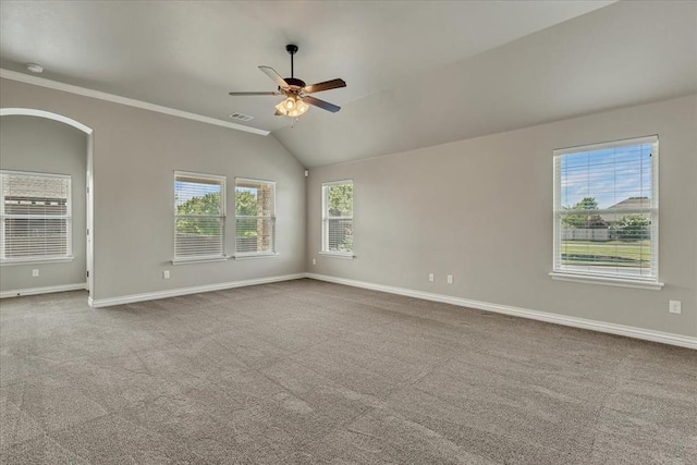 600 Nathan Way, Yukon, OK 73099 - unfurnished room with ceiling fan, carpet flooring, lofted ceiling, ornamental molding, and arched walkways