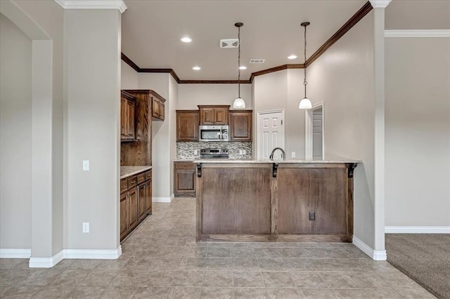 600 Nathan Way, Yukon, OK 73099 - kitchen featuring stainless steel microwave, crown molding, a peninsula, backsplash, and light countertops