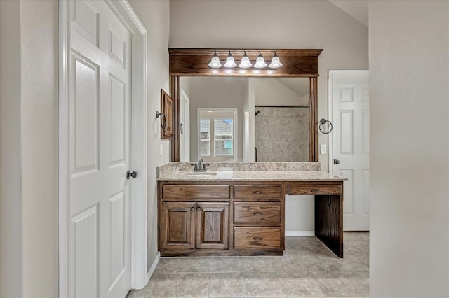 600 Nathan Way, Yukon, OK 73099 - full bath with vanity, tiled shower, lofted ceiling, and tile patterned flooring