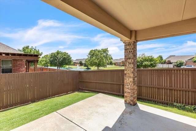 600 Nathan Way, Yukon, OK 73099 - fenced backyard featuring a patio area and a residential view