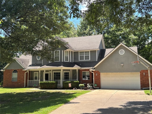 1800 N Elm Ave, Shawnee, OK 74804 - view of front facade featuring an attached garage, concrete driveway, covered porch, and brick siding