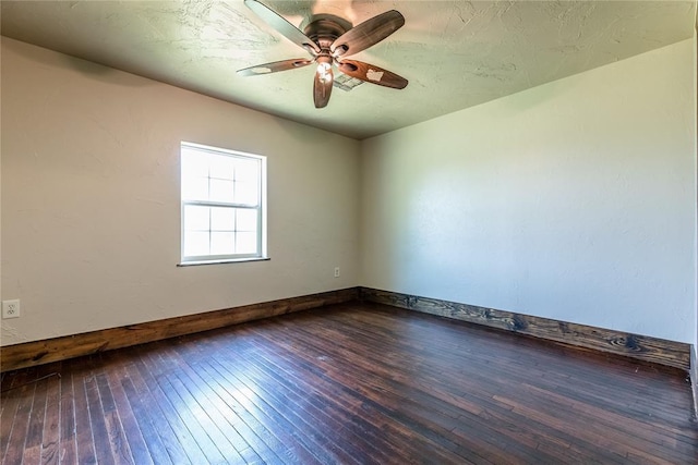 22807 E 1070th Rd, Clinton, OK 73601 - empty room with dark wood-type flooring and a ceiling fan