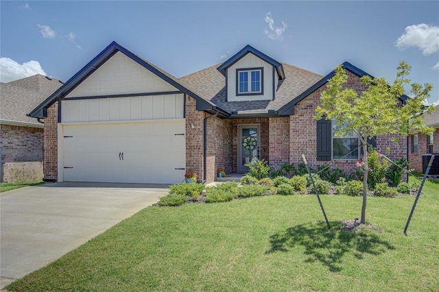 9120 NW 123rd St, Yukon, OK 73099 - view of front of home featuring a garage, brick siding, roof with shingles, a front lawn, and driveway