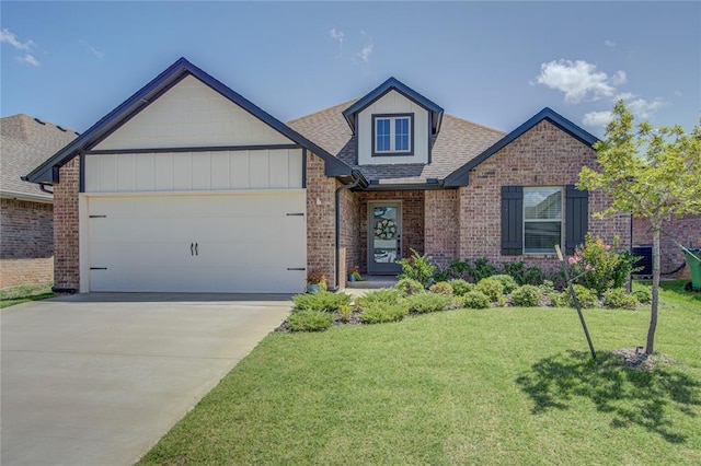 9120 NW 123rd St, Yukon, OK 73099 - view of front of property featuring brick siding, a garage, roof with shingles, a front lawn, and concrete driveway