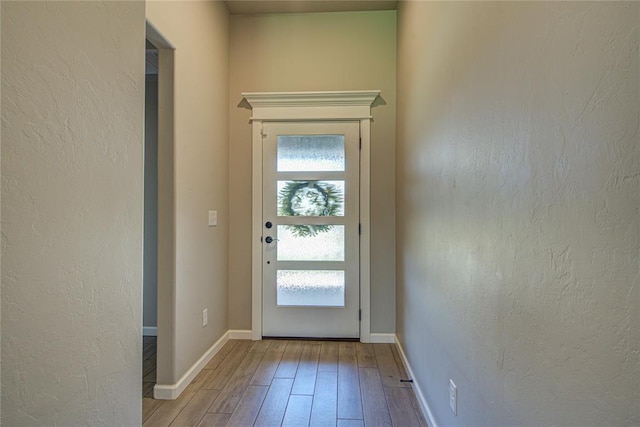 9120 NW 123rd St, Yukon, OK 73099 - doorway to outside with wood-type flooring and a textured wall