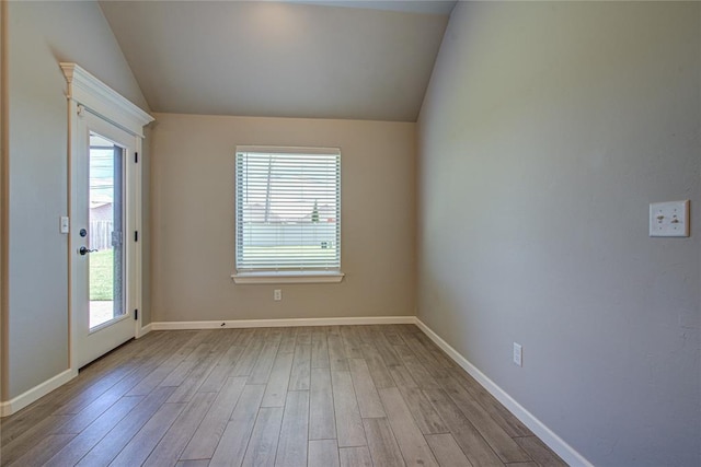 9120 NW 123rd St, Yukon, OK 73099 - empty room with vaulted ceiling, healthy amount of natural light, and wood finished floors