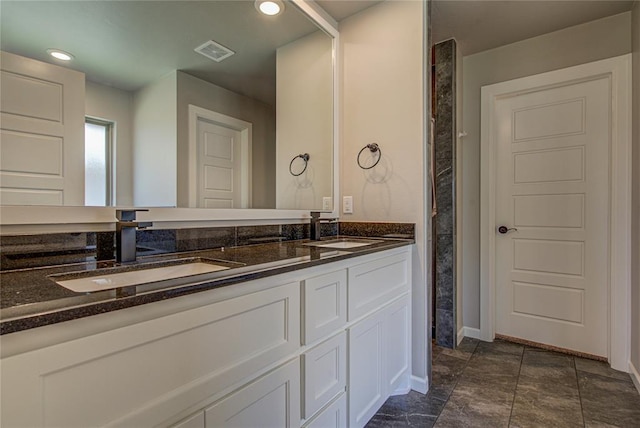 9120 NW 123rd St, Yukon, OK 73099 - bathroom featuring double vanity and baseboards