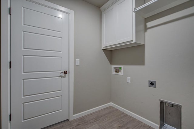 9120 NW 123rd St, Yukon, OK 73099 - washroom with hookup for an electric dryer, hookup for a washing machine, wood finished floors, and cabinet space