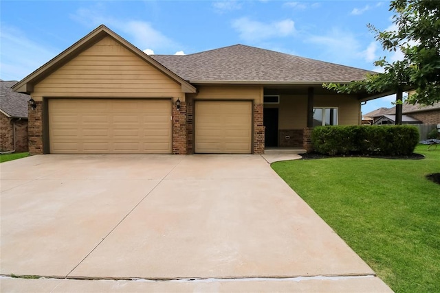 10928 NW 38th Ter, Yukon, OK 73099 - view of front facade featuring brick siding, a front lawn, a garage, and concrete driveway