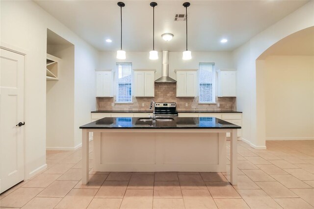 10928 NW 38th Ter, Yukon, OK 73099 - kitchen featuring electric stove, arched walkways, dark countertops, decorative backsplash, and recessed lighting