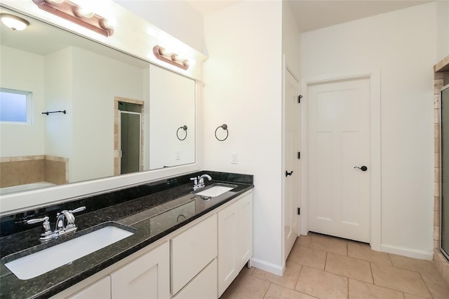 10928 NW 38th Ter, Yukon, OK 73099 - full bath featuring a stall shower, double vanity, tile patterned flooring, and a tub to relax in